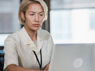 Office worker using laptop comfortably